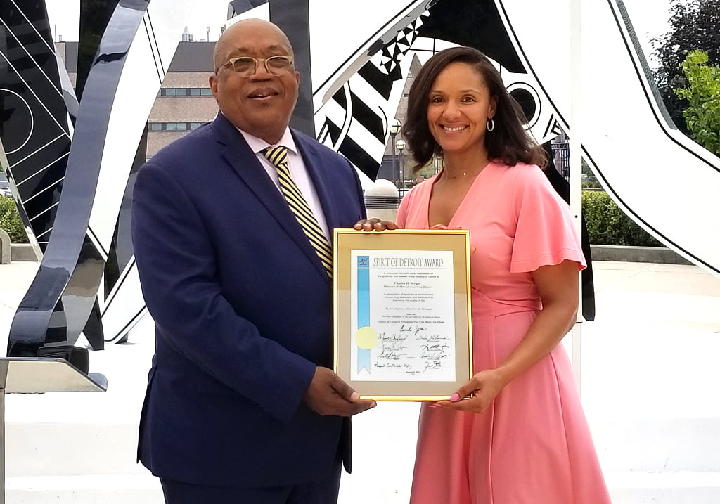 Wright Museum CEO Barclay and Detroit City Council Pro Tem Mary Sheffield hold a Spirit of Detroit Award