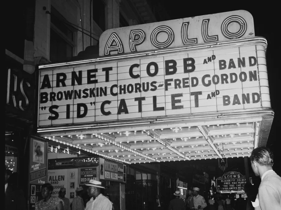 Black-and-white photograph of the Apollo Theater marquee