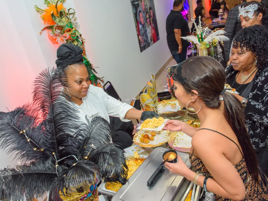 Caterer serving attendee food