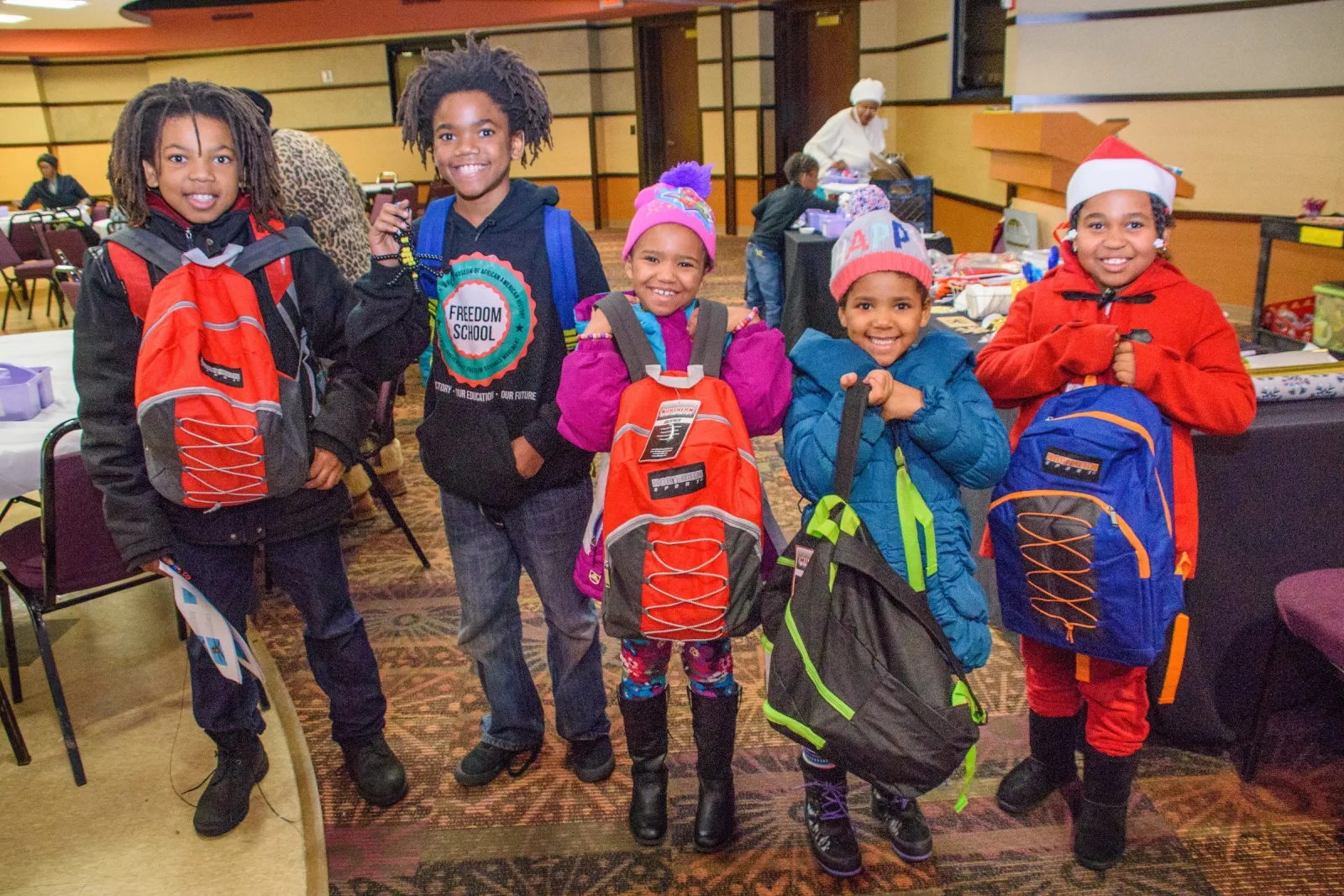 Kids posing with backpacks